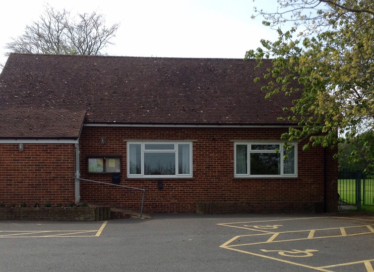 back of the hall with disabled parking and a ramp